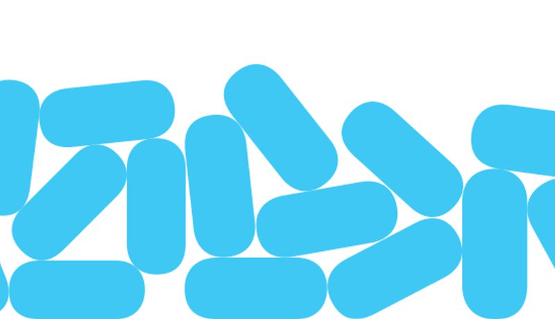 A pile of stylised light-blue PrEP pill shapes on a white background.