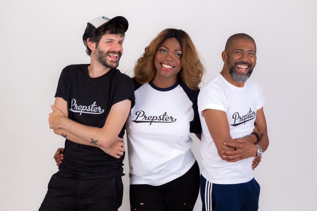 Three people standing together against a white background, laughing, all wearing "Prepster" t-shirts.