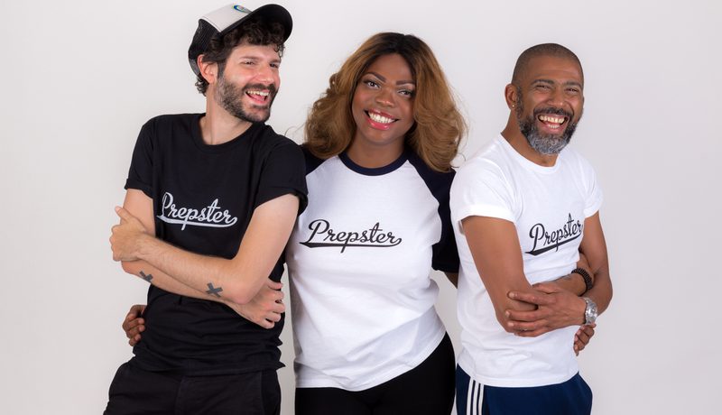Three people standing together against a white background, laughing, all wearing "Prepster" t-shirts.