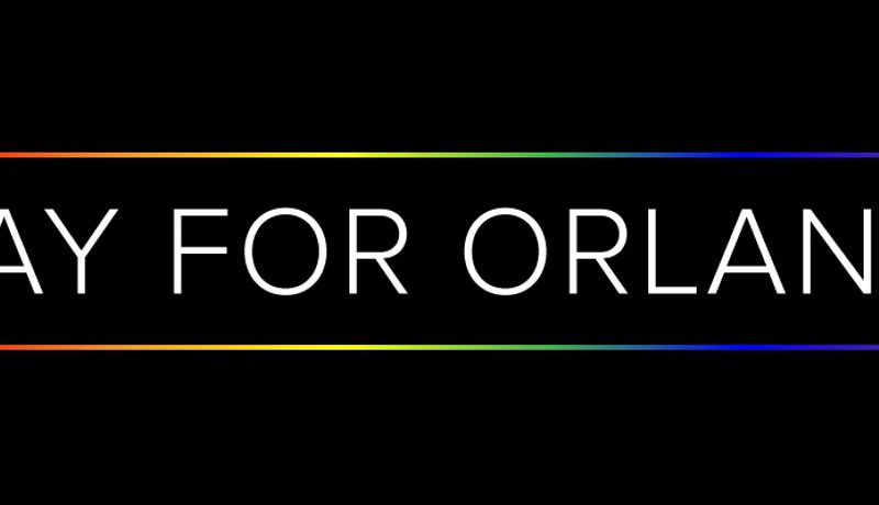 "Pray for Orlando" in white text on black, bordered by rainbow-coloured lines.