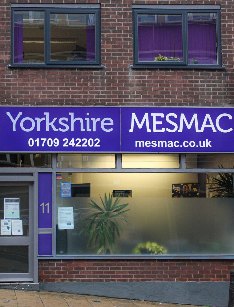 The Yorkshire MESMAC Rotherham office shopfront with a purple sign and a numbered door.