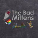 "The Bad Mittens" badminton logo with a shuttlecock, a Progress Pride heart and a player, on a grey background.